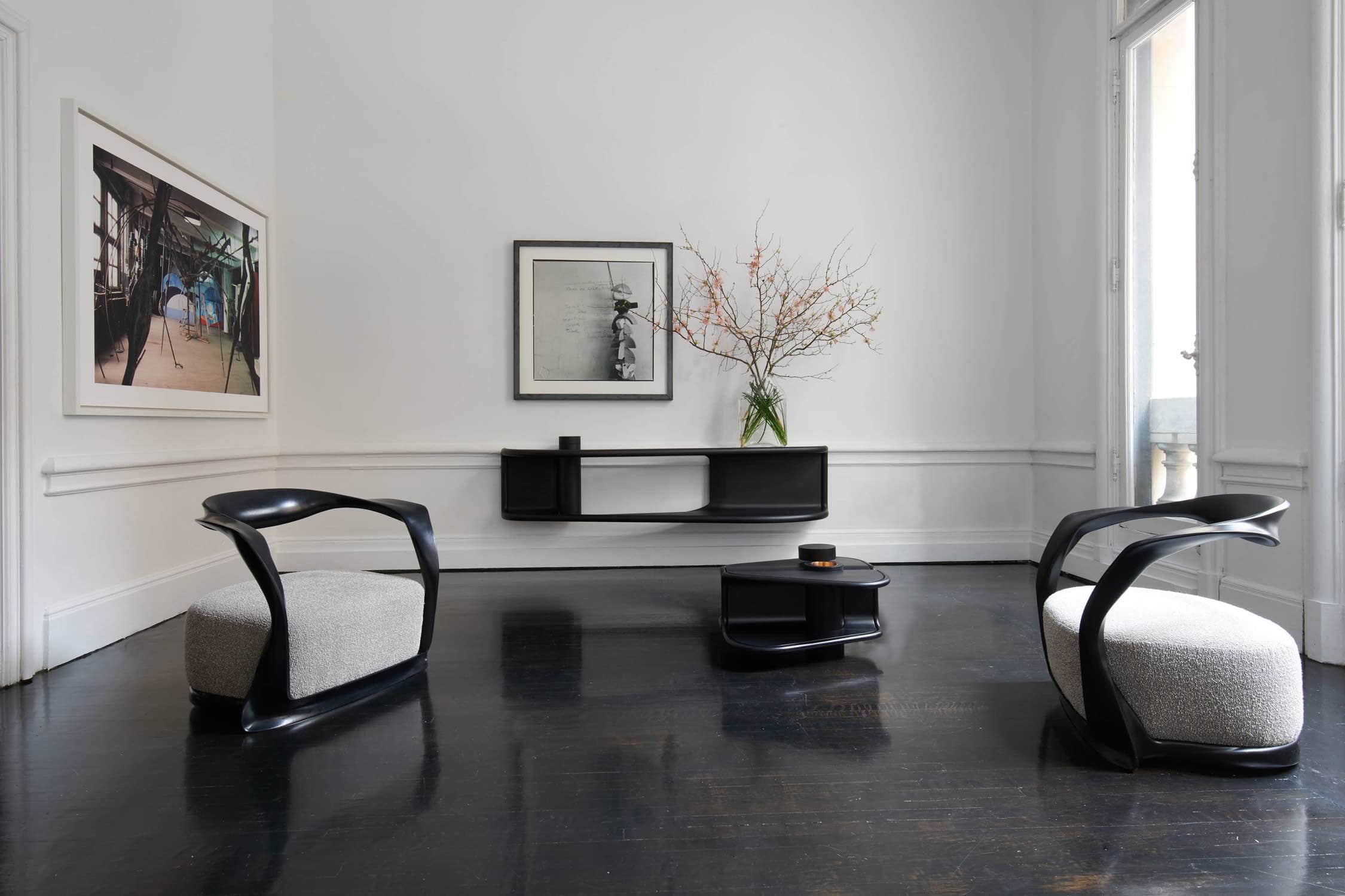 Shown in this image is the double emperor, flying shelf designed by Carol Egan.  The console is fabricated in ebonized mahogany.  The dimensions are 20.5"h x 84"w x 18"d (52 x 213 x 46cm).   The console is shown here with the second empress coffee table and ebonzied mahogany ombre chair designed by Carol Egan.