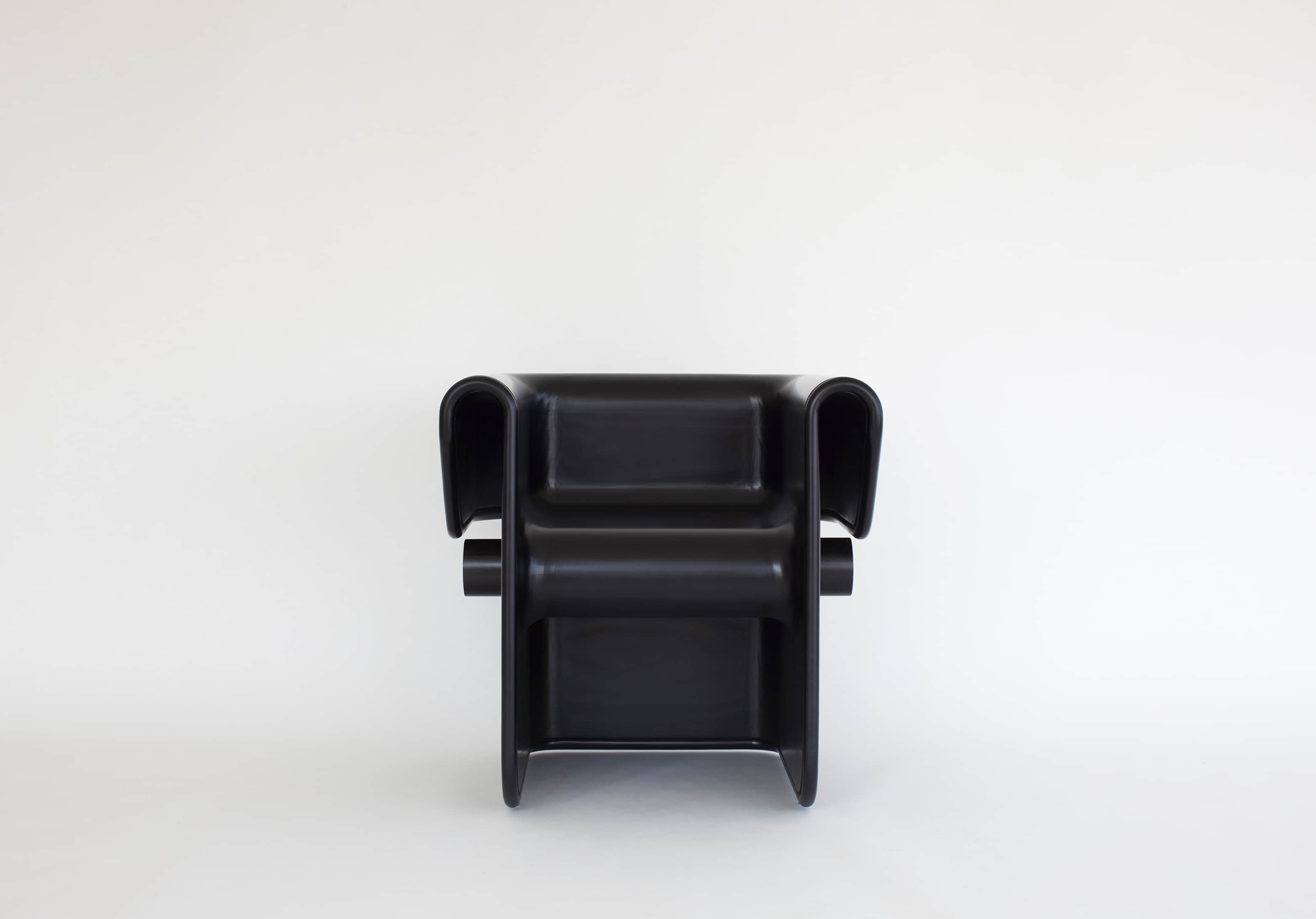 Designed by Carol Egan, the zephyr Chair in ebonized Accoya wood.